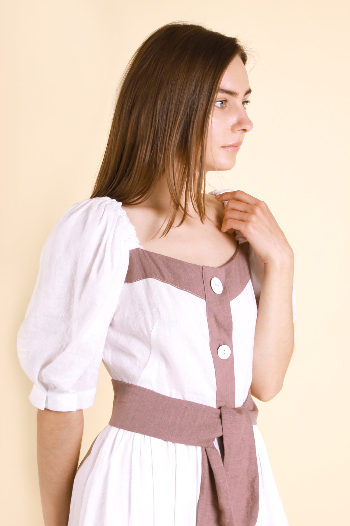 MIDI White Puff Sleeves Linen Dress MARIANNA made with high-quality linen-viscose fabric, features charming puff sleeves and buttons at the front for added flair.