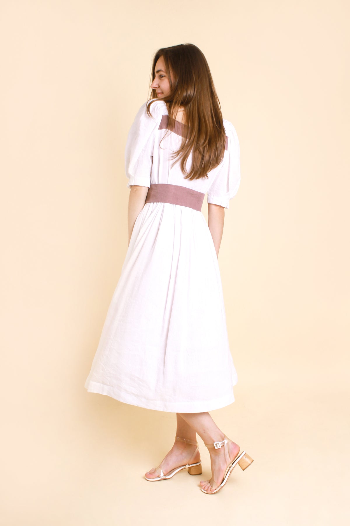 MIDI White Puff Sleeves Linen Dress MARIANNA made with high-quality linen-viscose fabric, features charming puff sleeves and buttons at the front for added flair.