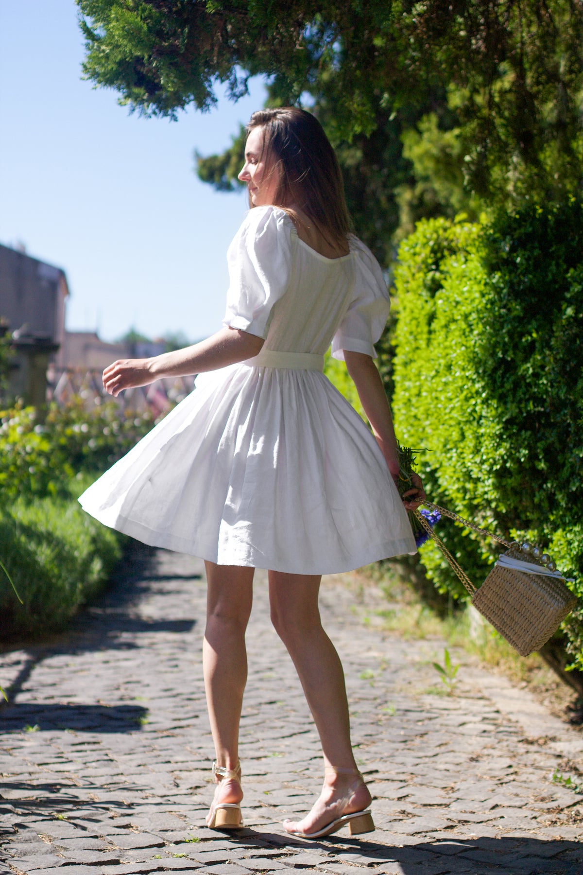 White short and stylish linen dress with a belt