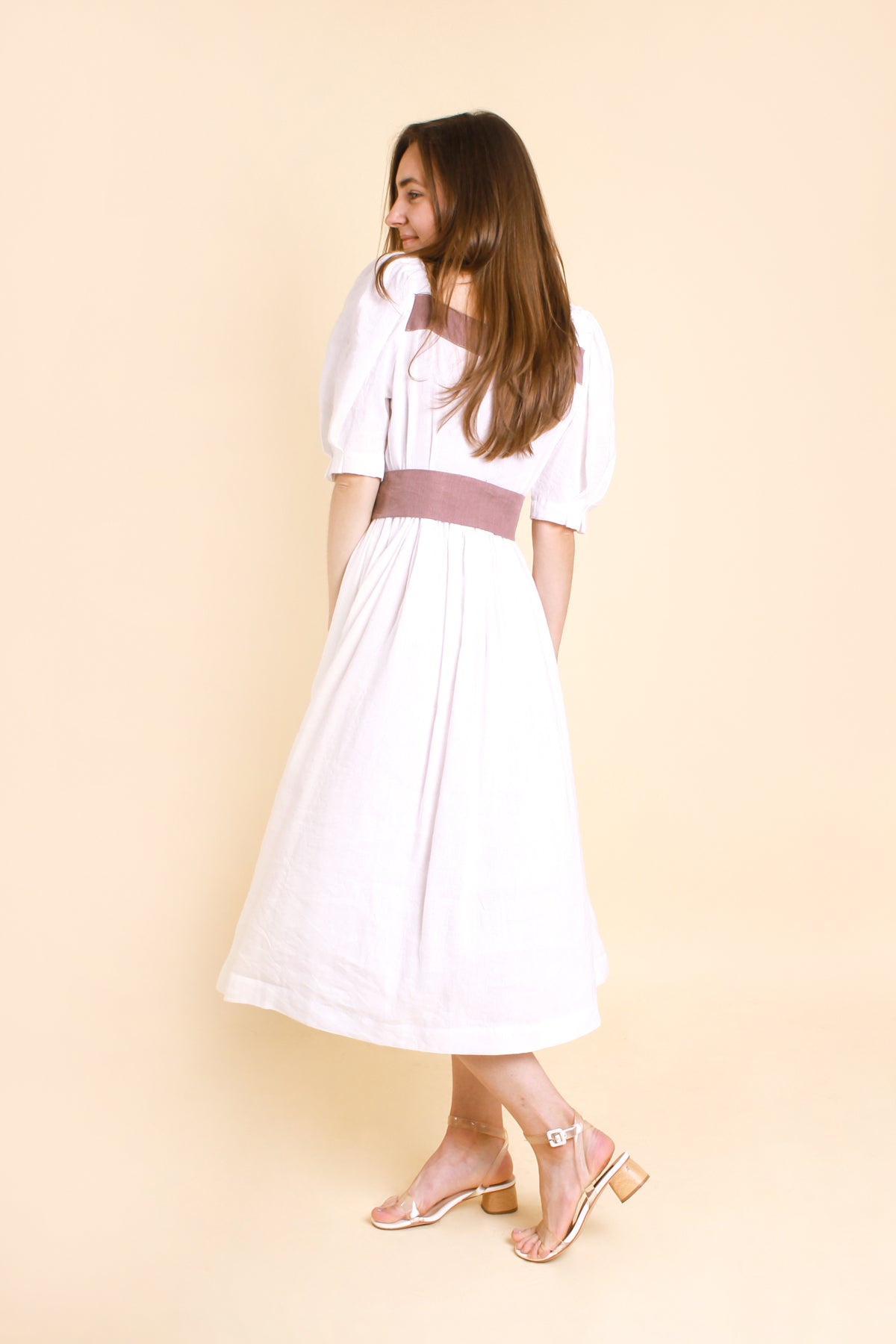  MIDI White Puff Sleeves Linen Dress MARIANNA made with high-quality linen-viscose fabric, features charming puff sleeves and buttons at the front for added flair. 